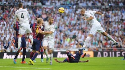 Portuguese defender Pepe, right, heads in Real Madrid' second goal during October's El Clasico at Santiago Bernabeu. Madrid won the game 3-1. Denis Doyle / Getty Images