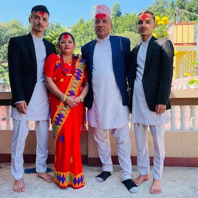 Ram Kumar Rijal, second right, with family members on the balcony of his home near Trishuli Bazar, Nepal. Photo: Ram Kumar Rijal