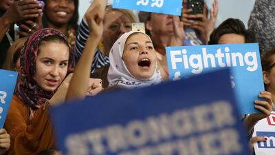 Women wearing headscarves listen to Hillary Clinton speak at a voter registration rally in Detroit, Michigan, on October 10, 2016. Lucy Nicholson / Reuters
