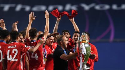 Bayern's coach Hansi Flick holds the Champions League trophy. AP