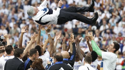 Real Madrid players throw coach Carlo Ancelotti into the air. EPA