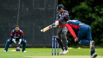 The UAE's Mohammad Shahzad, shown here attempting to hit a ball from Jitendra Mukhiya of Nepal during an ICC World Twenty20 Qualifier warm-up match, hopes his team will rebound from their recent loss to Scotland. Brendan Moran / ICC