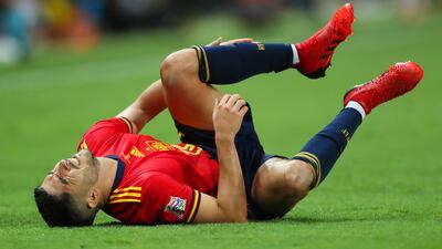 Carlos Soler of Spain lays on the field injured. Getty Images