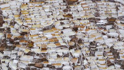 A view of salt ponds at the Maras mines in Cuzco. Salt has been obtained in Maras since pre-Incan times by evaporating highly salty local subterranean stream water. The water is intricately channelled through constructions, flowing gradually down on to several hundred ancient terraced ponds. From each pond, a local member of the mine cooperative can produce 150 to 200 kilos per month which can be sold in the markets at $0.34 per kilogram, according to miners. Enrique Castro-Mendivil / Reuters