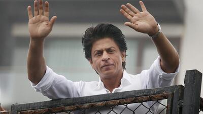 Bollywood actor Shah Rukh Khan greets fans waiting outside his residence in Mumbai on Eid Al Fitr. Rajanish Kakade / AP Photo / July 7, 2016