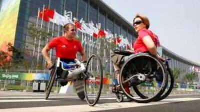 Dame Tanni Grey-Thompson, right, who has been in Beijing coaching Britain's Brian Alldis, left, is supporting a scheme where sponsors across all sports donate money to the Paralympic governing body.