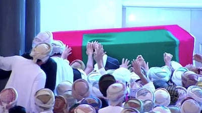 Mourners pay their respects as the coffin of Oman's Sultan Qaboos bin Said passes during the funeral procession in Muscat on January 11, 2020. Oman TV via Reuters