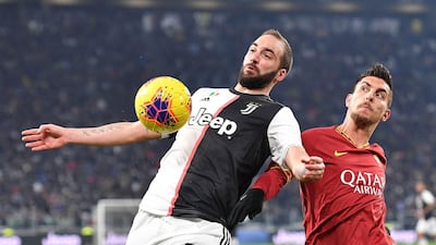 Gonzalo Higuain and Lorenzo Pellegrini. EPA