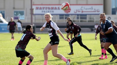 Dubai Falcons send the ball wide as they take on Al Maha at Sharjah Wanderers Sports Club, Sharjah, in the UAE women's rugby sevens. Khushnum Bhandari / The National