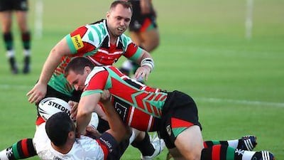 Abu Dhabi Harlequins, in red and green, had the Mana Dubai side covered, winning the Rugby League cup 62-10 yesterday.