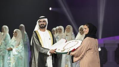 Sheikh Mohammed bin Rashid, Vice President and Ruler of Dubai, presents the Zayed Medal to Sheikha Lubna Al Qasimi, Minister of State for Tolerance, who received it on behalf of Sheikha Fatima, widow of the late Founding Father Sheikh Zayed, during the Mother of the Nation Festival’s opening ceremony at Abu Dhabi National Exhibition Centre. Ryan Carter / Crown Prince Court - Abu Dhabi