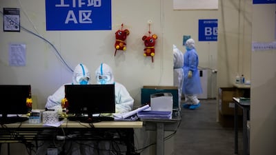 Medical staff in protective suits work at Wuhan Fang Cang makeshift hospital in Wuhan, Hubei Province, China. EPA