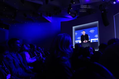 Attendees watch Elon Musk at the World Economic Forum gathering in Davos. Bloomberg