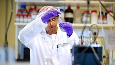 Masdar Institute student Ahmed Al Harithi at work on his research project exploring the potential for local strains of algae to produce biofuel for the UAE. Mike Malate / Masdar Institute