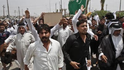 Family members of Diaa Mutashar Al Issawi chant anti-Free Syrian Army slogans during his funeral in Basra.