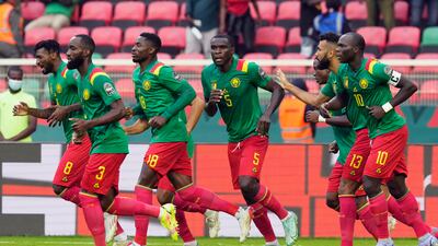 Cameroon celebrate after scoring. AP