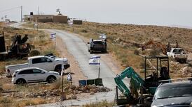 Israeli flags flutter near a Palestinian village in the occupied West Bank. Reuters