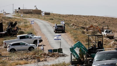Israeli flags flutter near a Palestinian village in the occupied West Bank. Reuters