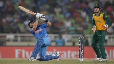 Virat Kohli hits out for six runs against South Africa in the World Twenty20 semi-final on April 4, 2014. Gareth Copley / Getty Images