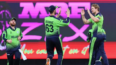 Ireland's Barry McCarthy, right, is congratulated by his captain Andrew Balbirnie after dismissing Australia's Mitchell Marsh. AP