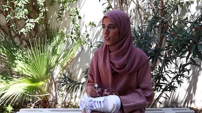 Henna artist Azra Khamisssa paints a trainer at her residence in Dubai. Reuters