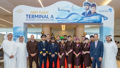 Etihad Airways flight crew ready for the inaugural flight from Terminal A, where the airline will offer biometric bag drops