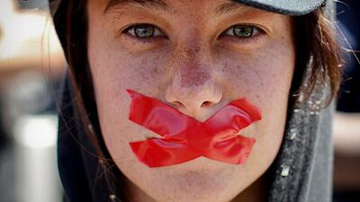 A woman protests against the passing of new laws on state secrets outside parliament in Cape Town, South Africa. Nic Bothma / EPA