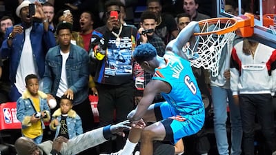 Oklahoma City player Hamidou Diallo (R) dunks the ball over the top of Shaquille O'Neal (L) in the Slam Dunk Contest during the All-Star Saturday Night on All-Star Weekend at the Spectrum Center in Charlotte, North Carolina, USA, 16 February 2019. EPA