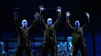 The Blue Man Group performs on stage during a media preview ahead of their show in Singapore on March 31, 2016. The Blue Man Group, formed in the US in 1991, is in Singapore as part of a worldwide tour from March to July 2016. / AFP PHOTO / ROSLAN RAHMAN