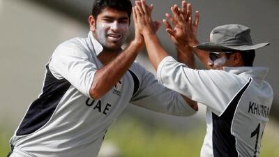 The UAE's bowler Ahmed Raza, left, and Khurram Khan, right, had a good day against the UAE.