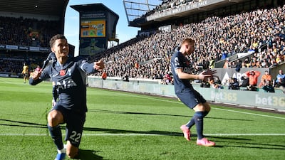 Tottenham's Brennan Johnson, left, after scoring the opener. AP