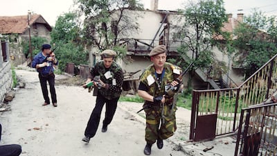 Bosnian fighters patrol in Sarajevo in June 1992. AFP