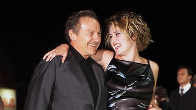 Harvey Keitel and Kate Winslet, in a square-necked midi, attend a screening of 'Holy Smoke' at the Venice Film Festival on September 4, 1999 in Venice, Italy. EPA