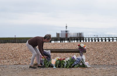 A woman lays lowers on the beach at Shoreham. Getty Images