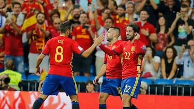 Isco, right, scored twice during Spain's 3-0 2018 World Cup qualifying win over Italy on Saturday. Paul White / AP Photo