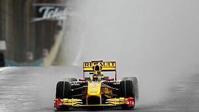 Renault's Robert Kubica led the field in the final practice session at a wet Interlagos.