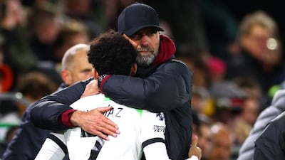 Jurgen Klopp, manager of Liverpool, embraces Luis Diaz. Getty