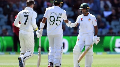 Pakistan's Asad Shafiq, right, celebrates after reaching his fifty on day four of the second Test in Adelaide on Monday. AFP