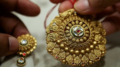 A gold item at a jewellers in India's capital New Delhi. Bullion prices were set for their best month since March 2024. Reuters