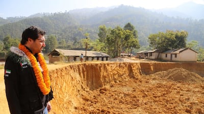 Tariq Al Gurg, chief executive of Dubai Cares, oversees construction as part of a Dh9m programme to help children in Nepal return to education. Courtesy Memac Ogilvy Public Relations