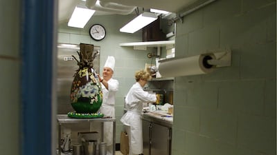 White House pastry chef Roland Mesnier puts the finishing touches on a 23kg chocolate Easter egg for the annual White House Easter Egg Roll on April 13, 2001. Photo: Newsmakers