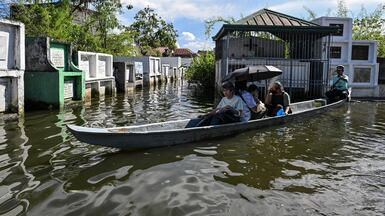 People visit the graves of relatives by boat on All Saints' Day, in the flooded Hagonoy Public Cemetery in Bulacan, Philippines. Reuters