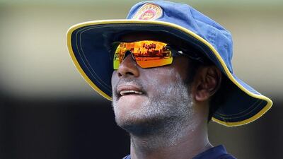 Surroundings of the P. Sara Oval, the venue of the second test cricket match between Sri Lanka and West Indies, is reflected of the sunglasses of Sri Lankan cricket captain Angelo Mathews during a practice session in Colombo, Sri Lanka, Wednesday, Oct. 21, 2015. (AP Photo/Eranga Jayawardena)