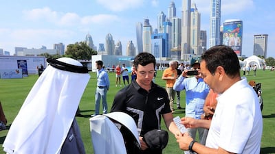 DUBAI, UNITED ARAB EMIRATES - FEBRUARY 03: His Royal Highness Prince Rachid of Morocco (r) is presented with a set of Nike Golf clubs and a hand written note by Rory McIlroy of Nortehrn Ireland and a 'Golf in Dubai' golf bag by Mohamed Juma Buamaim The Deputy Chairman and Ceo of Golf in Dubai during the pro-am as a preview for the 2016 Omega Dubai Desert Classic on the Majlis Course at the Emirates Golf Club on February 3, 2016 in Dubai, United Arab Emirates. (Photo by David Cannon/Getty Images)