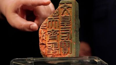 The Imperial Green Jade Memorial Seal for the Hongxi period of China's Yongle Empress Wen during the Ming Dynasty (1368 to 1644), is displayed during an auction preview in Hong Kong. Three seals for up for auction and are separately expected to fetch between $16.1million to $23.2m, $10.3m to $12.9m, and $3.2m to $3.9m. AP