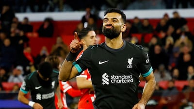 Mohamed Salah celebrates scoring Liverpool's winner from the penalty spot. Reuters