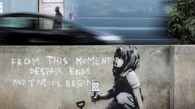 A graffiti believed to have been created by street artist Banksy is seen at Marble Arch in London, Britain. Reuters