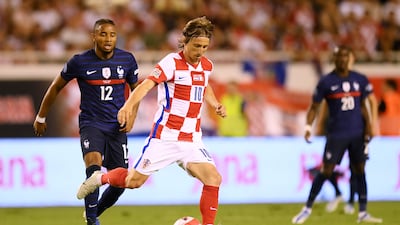Luka Modric of Croatia controls the ball whilst under pressure from Christopher Nkunku of France. Getty Images