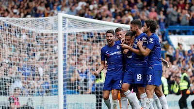 Eden Hazard celebrates scoring his and Chelsea's third goal from the penalty spot with teammates. Reuters