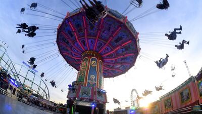 People enjoy a ride on a merry-go-round at the Oktoberfest festival in Munich, Germany. Felix Hoerhager/AP Photo